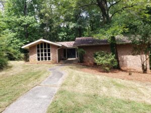 After professional brush clearing and extensive tree trimming in Cumming GA - clean, open yard and maintained landscaping