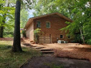 After major cleanup and trimming by Barber Landscaping in Cumming GA - neat, accessible yard with trimmed trees and shrubs